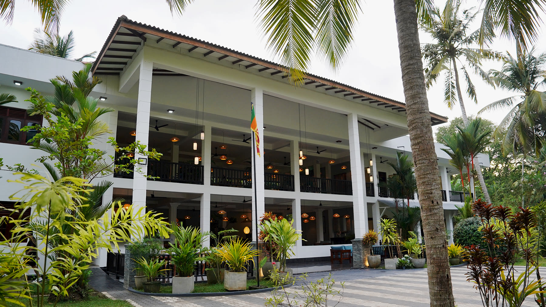 Breathe Collections boutique hotel glowing at dusk, Habaraduwa Sri Lanka