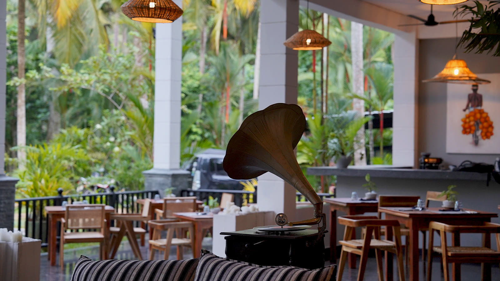 Evening dining on the terrace at The Palm restaurant, Breathe Collections