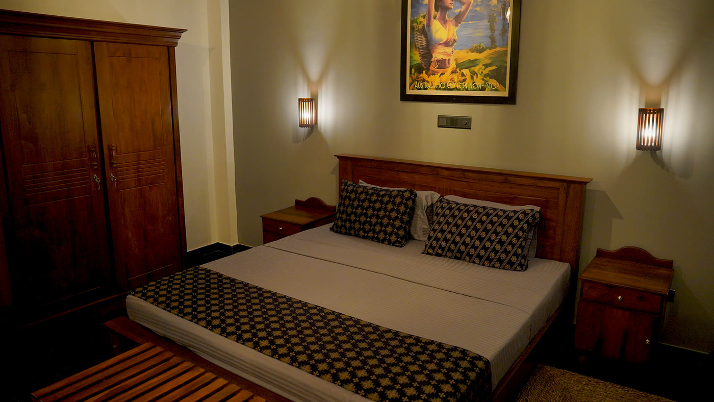 Warm-lit double room in the evening at Breathe Collections