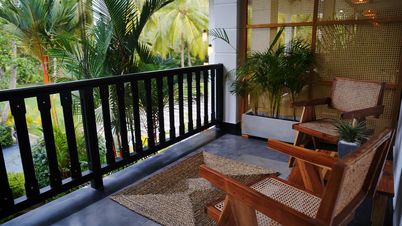 Private balcony with planter chairs overlooking the gardens, Breathe Collections